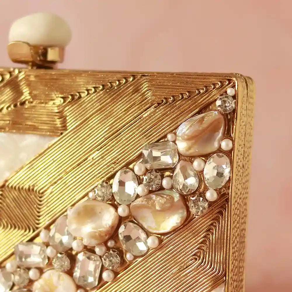Aisha embellished mother of pearl clutch by The Tan Clan with intricate beadwork and a sleek, elegant design for evening occasions.