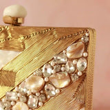 Aisha embellished mother of pearl clutch by The Tan Clan with intricate beadwork and a sleek, elegant design for evening occasions.