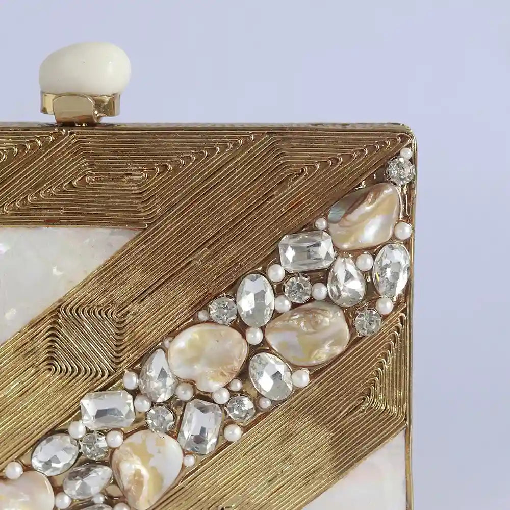 Aisha embellished mother of pearl clutch by The Tan Clan, featuring intricate beadwork and a sleek, elegant design.