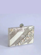 Aisha Embellished Mother of Pearl Clutch by The Tan Clan showing a stylish clutch with mother of pearl embellishments and intricate detailing.