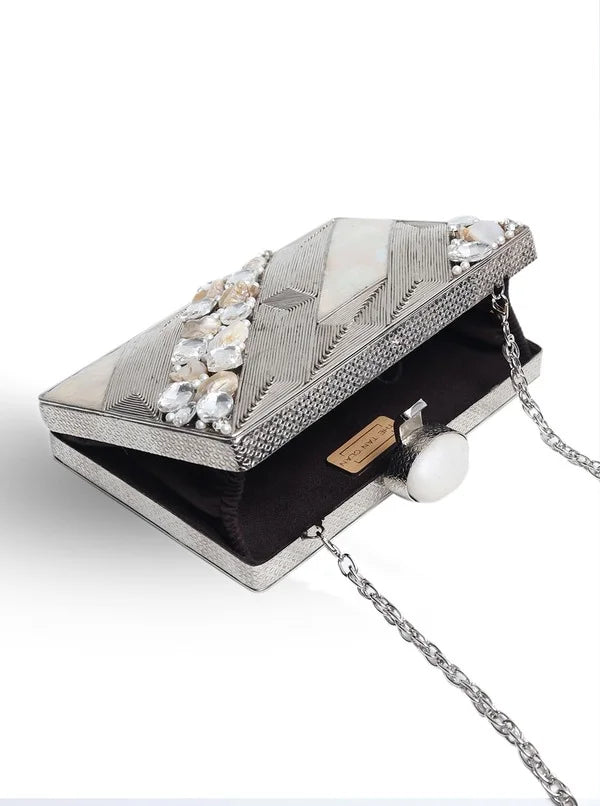 Aisha embellished Mother of Pearl clutch by The Tan Clan featuring intricate pearl detailing and a sleek elegant design.