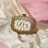 Alia Mother of Pearl Clutch by The Tan Clan featuring a luminous mother of pearl exterior and elegant design.