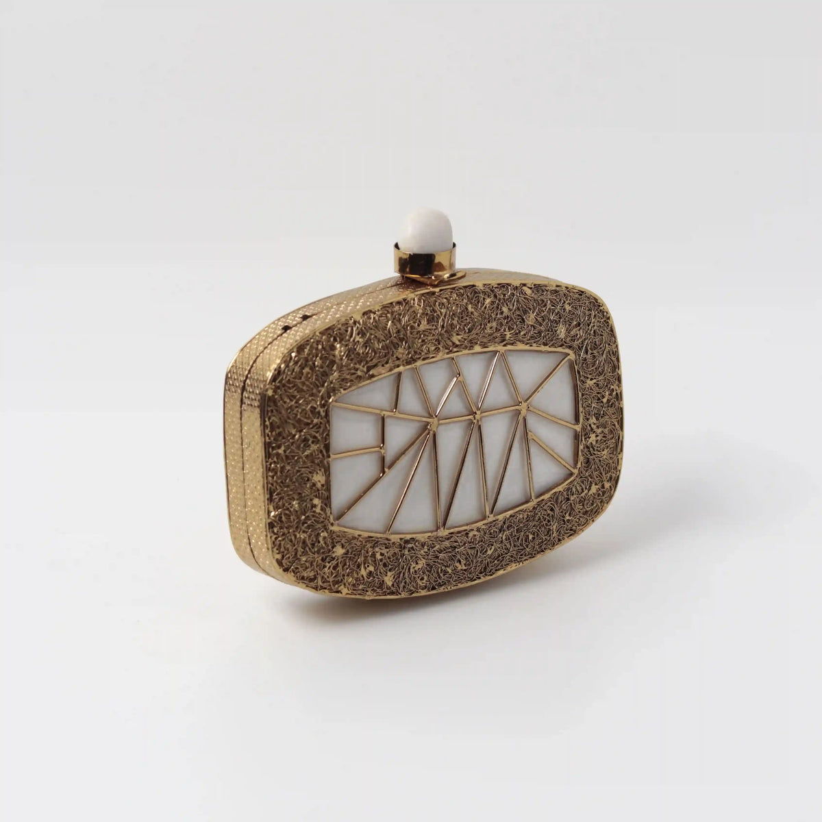 Alia Mother of Pearl Clutch by The Tan Clan featuring iridescent pearl finish and elegant design for evening occasions.