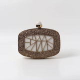 Alia Mother of Pearl Clutch by The Tan Clan, showcasing a shimmering pearl finish and elegant design for evening wear.