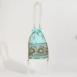 Ama Potli bag with pearl handle from The Tan Clan, featuring traditional design and elegant pearl accents.