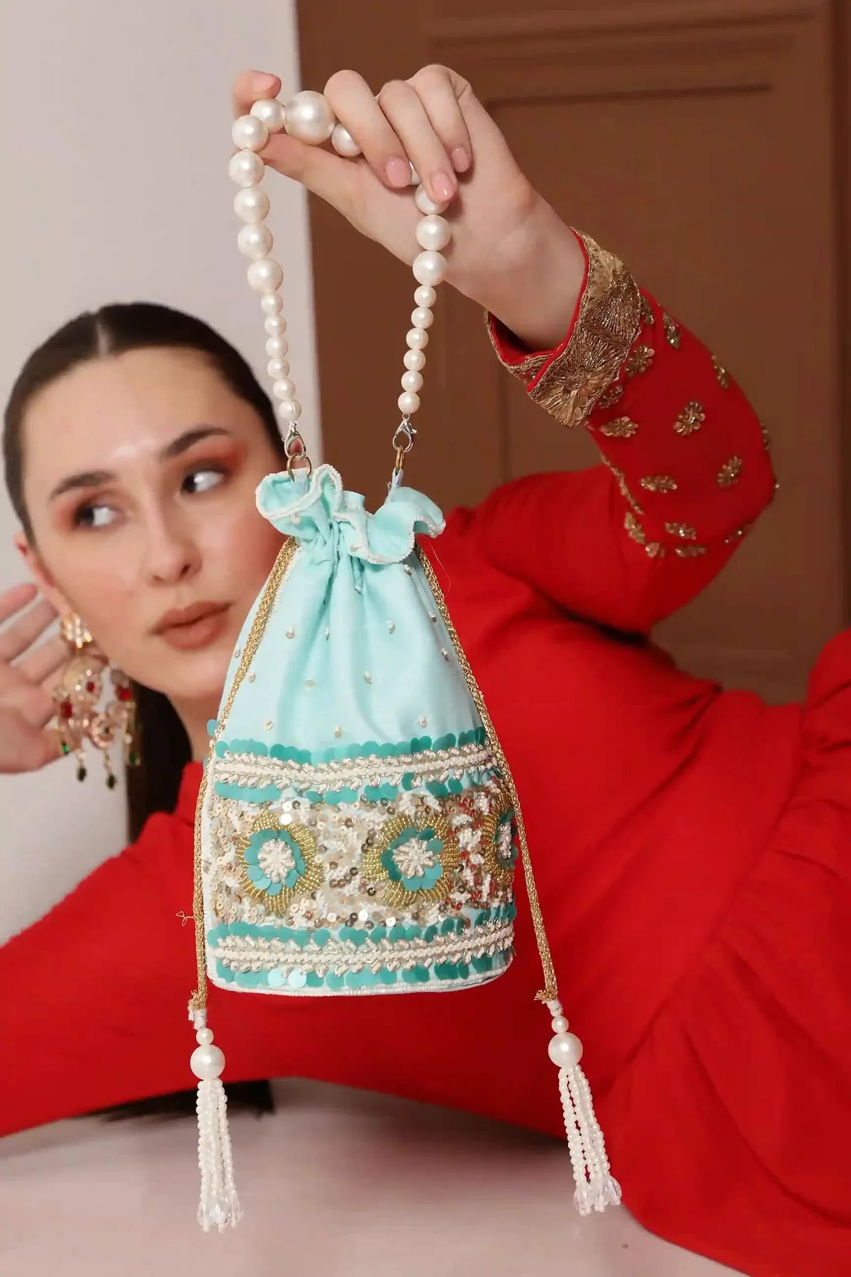 Ama Potli Bag with Pearl Handle by The Tan Clan, featuring elegant pearl accents and traditional drawstring closure.