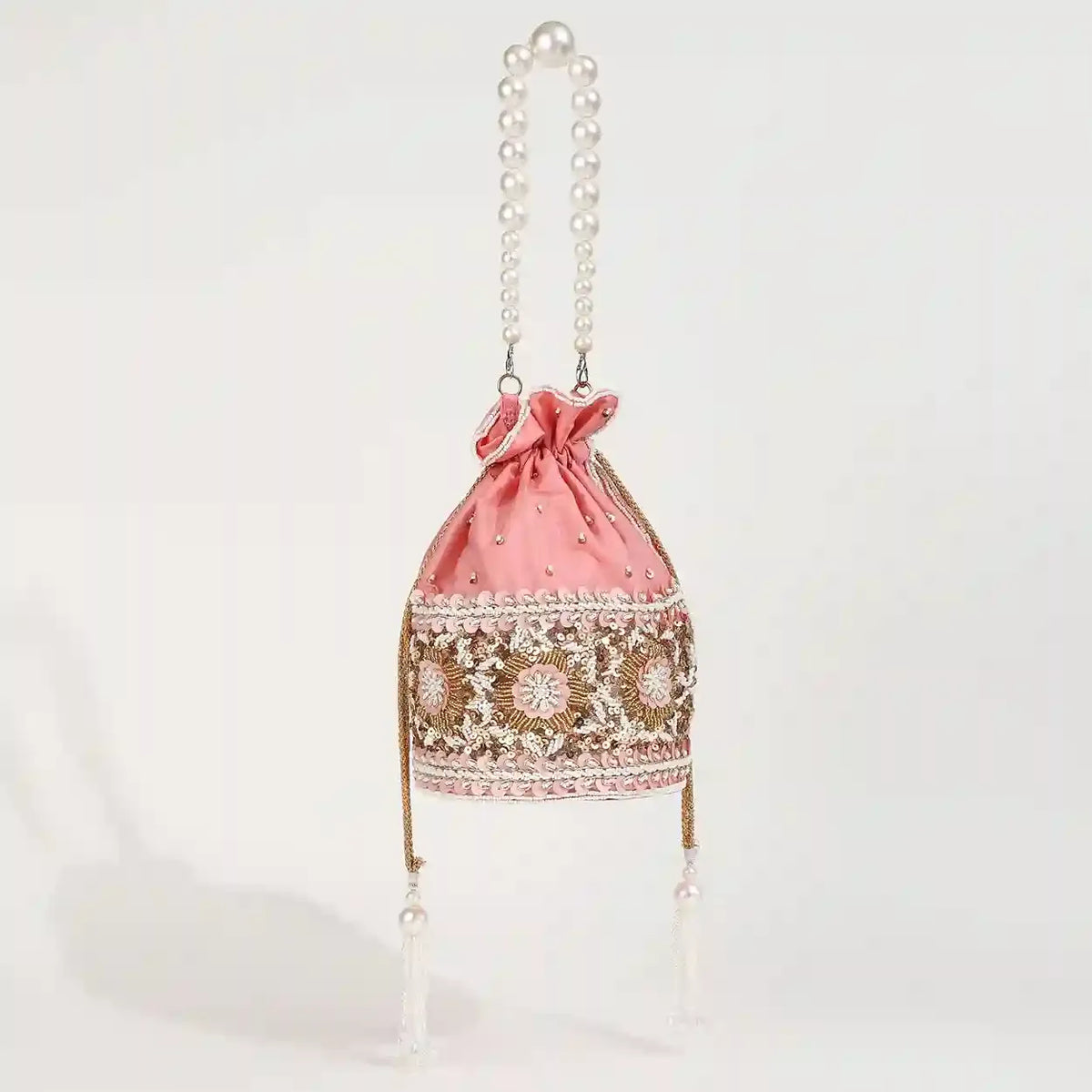 Ama Potli Bag with pearl handle from The Tan Clan, featuring traditional design and elegant pearl accents.
