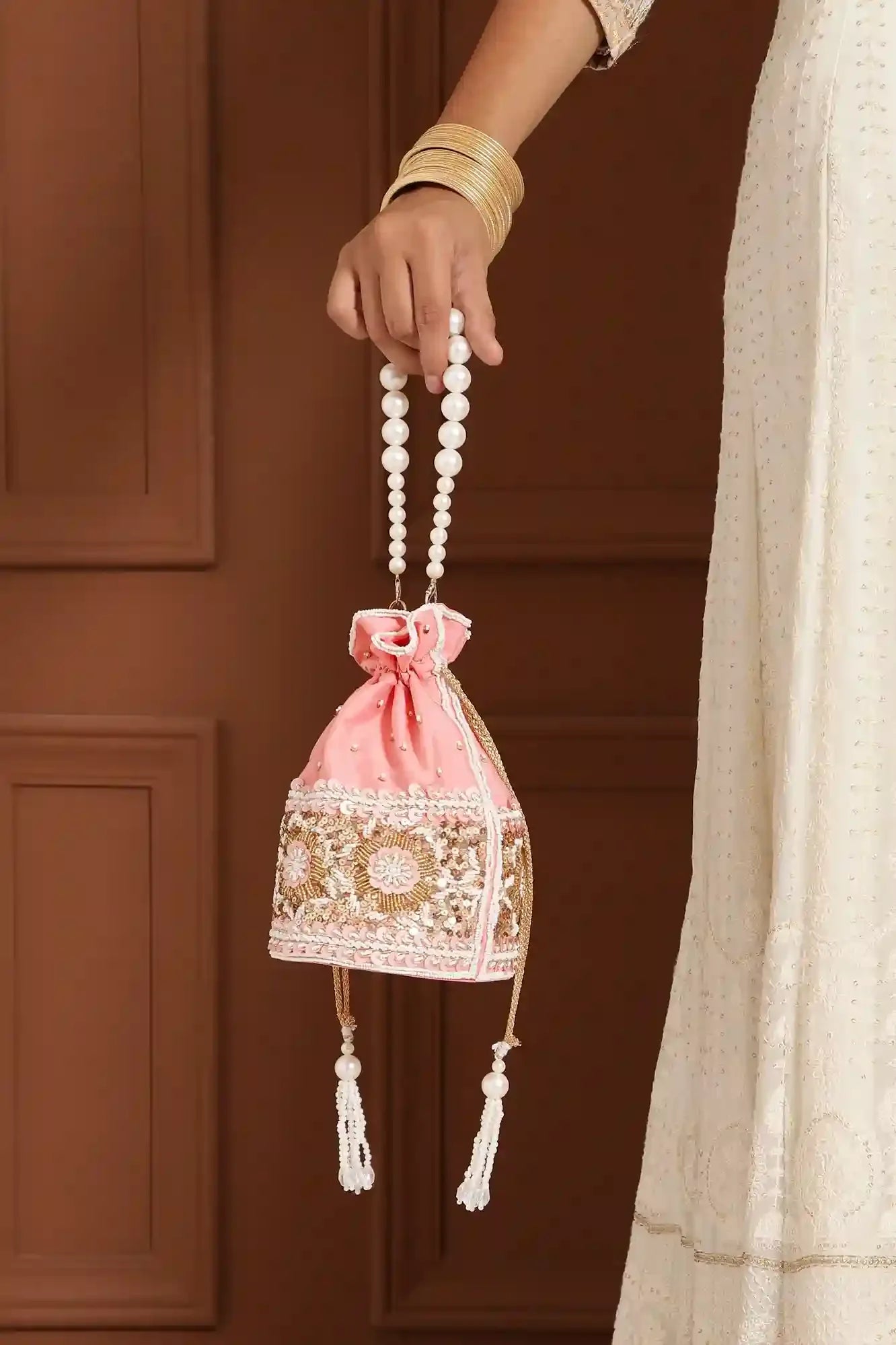 Ama Potli Bag with pearl handle from The Tan Clan, featuring intricate embroidery and elegant design for special occasions.