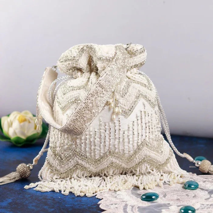 Amaal Potli Bag with Handle from The Tan Clan featuring intricate embroidery and traditional design, perfect for special occasions.