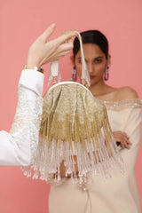 Tan Clan Amour Batua Bag with detachable handle, stylish leather handbag featuring a sleek design and versatile strap.