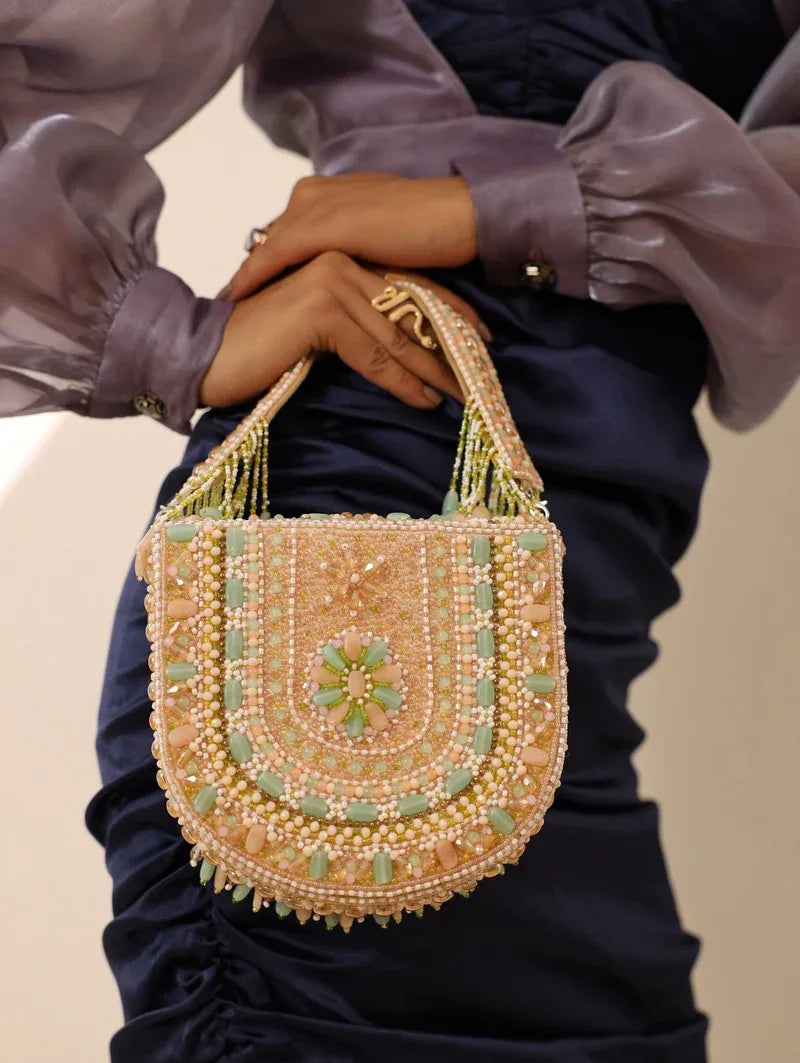 Tan Clan Amulya flap-over handbag with handle, stylish leather bag featuring a flap closure and adjustable shoulder strap.