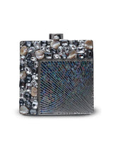 Aqua embellished brass clutch bag with intricate design, featuring detailed accents and a sleek, elegant shape.