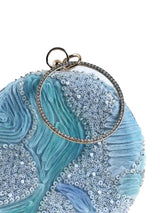 Aqua blue round clutch bag by The Tan Clan with a sleek, smooth surface and minimalist design, perfect for stylish evenings.
