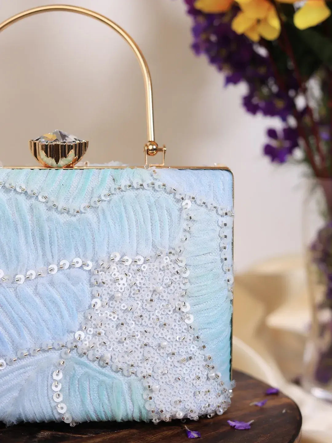 Set of three aqua blue casket clutch wedding favors by The Tan Clan, featuring elegant, compact design for special occasions.