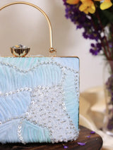 Set of three aqua blue casket clutch wedding favors by The Tan Clan, featuring elegant, compact design for special occasions.