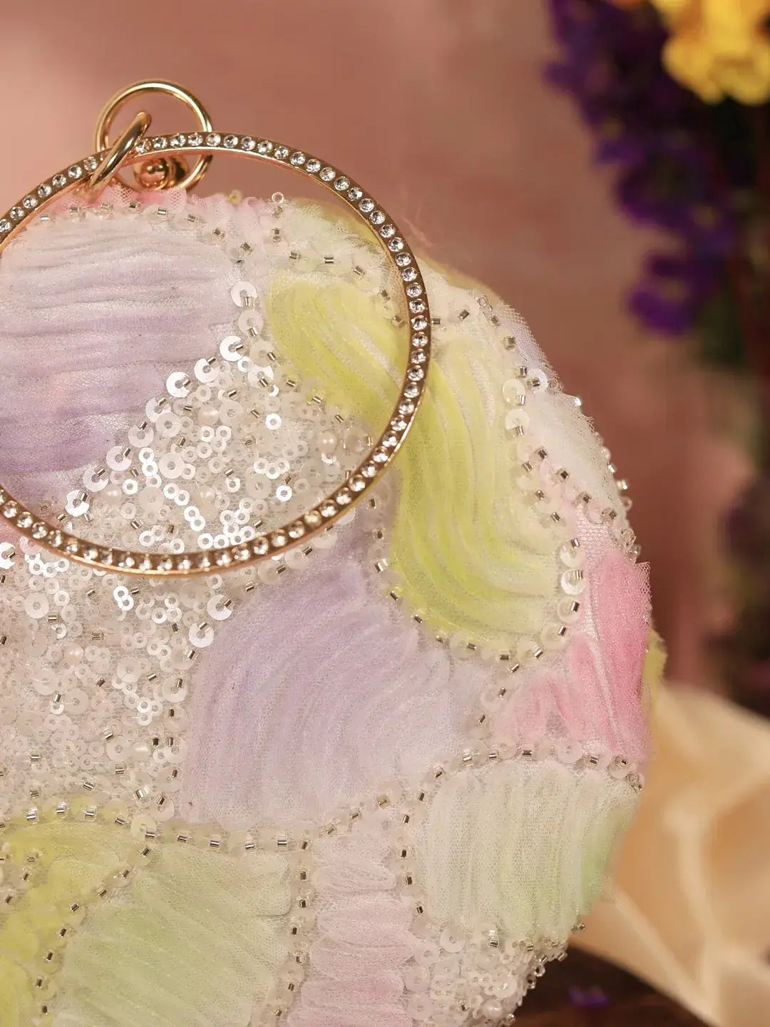 Aqua lavender round clutch bag from The Tan Clan with a smooth textured surface and gold-tone clasp detail.