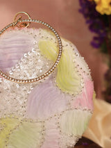 Aqua lavender round clutch bag from The Tan Clan with a smooth textured surface and gold-tone clasp detail.