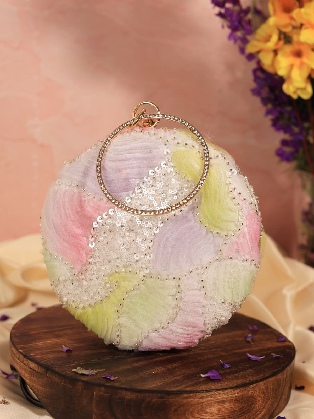 Aqua lavender round clutch bag from The Tan Clan with a sleek, smooth surface and compact design for stylish accessories.