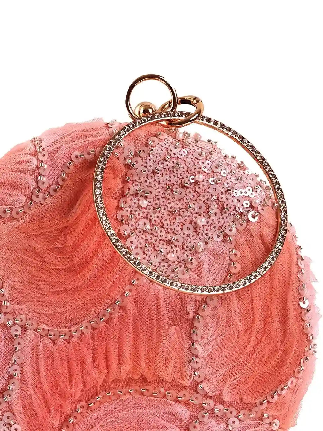 Aqua orange round clutch bag by The Tan Clan with a sleek, glossy finish and minimalist design on a neutral background.