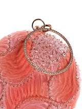 Aqua orange round clutch bag by The Tan Clan with a sleek, glossy finish and minimalist design on a neutral background.