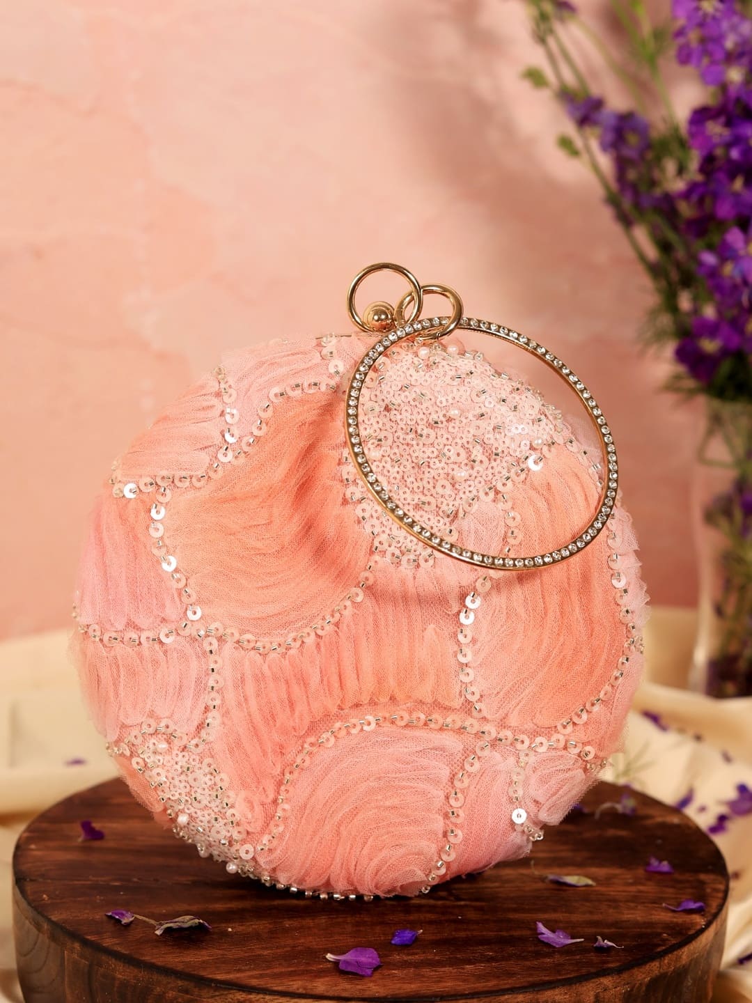 Aqua orange round clutch purse by The Tan Clan with a sleek, minimalist design and smooth fabric finish.
