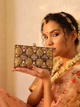 Elegant brass clutch with intricate embellishments from The Tan Clan, featuring detailed design and a polished finish.