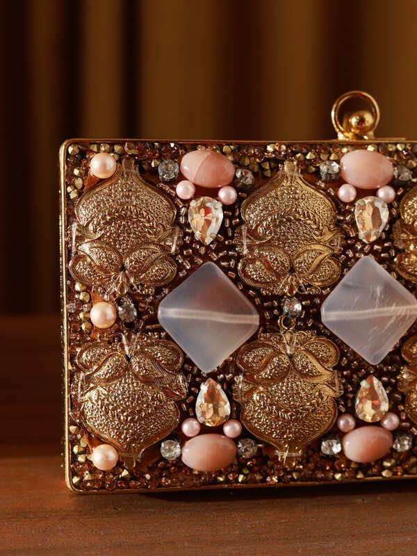Arya Embellished Brass Clutch by The Tan Clan featuring intricate brass detailing and elegant design for special occasions.