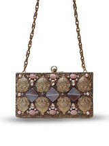 Arya embellished brass clutch by The Tan Clan featuring intricate metalwork and a sleek, elegant design.