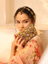 Elegant brass clutch with intricate embellishments from The Tan Clan, featuring detailed design and a sleek, compact style.