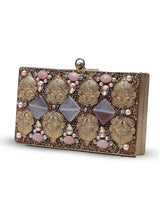 Arya Embellished Brass Clutch by The Tan Clan featuring intricate embellishments and a sleek, metallic design.