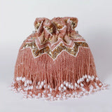 Asmi potli bag with tassles and handle by The Tan Clan, featuring traditional design and decorative accents.