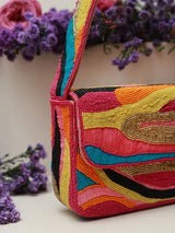 Multicolor Aster Baguette Bag with Handle by The Tan Clan, featuring vibrant woven design and a sturdy handle for stylish carrying.