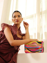 Multicolor Aster Baguette Bag with Handle by The Tan Clan, featuring vibrant colors and a sleek, compact design.