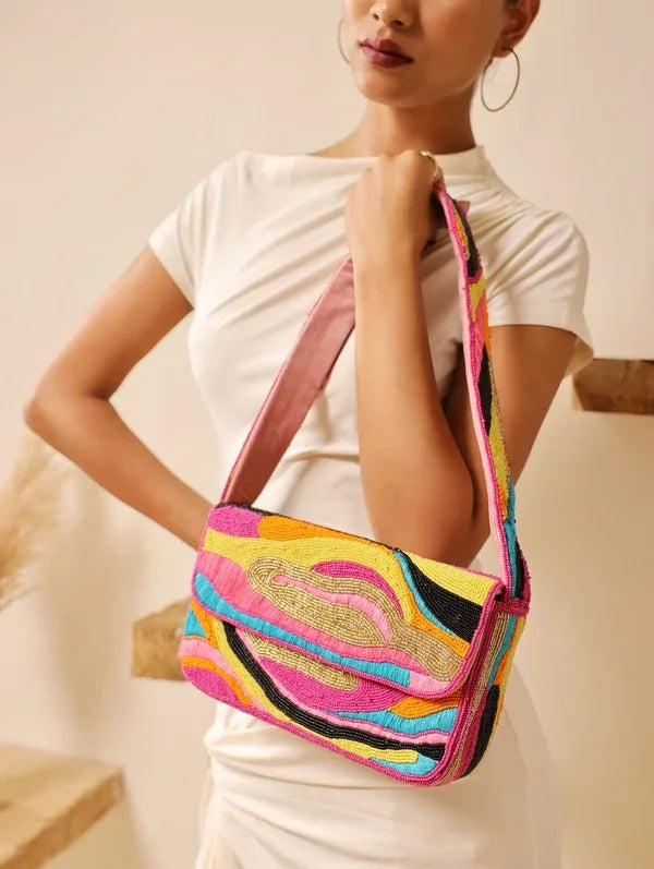 Multicolor Aster Baguette Bag with handle by The Tan Clan, featuring a vibrant, multicolored design and stylish shoulder strap.