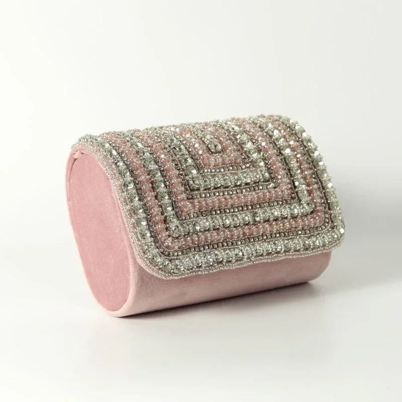 Aura Combo by THE TAN CLAN featuring Sana Mother of Pearl clutch and Nysa Pink flap bag with gold accents and elegant design.