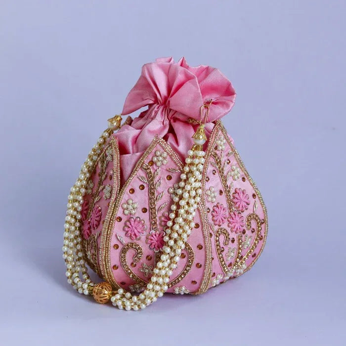 Hand-embroidered mini lotus potli bag by The Tan Clan with intricate detailing and traditional Indian textile design.