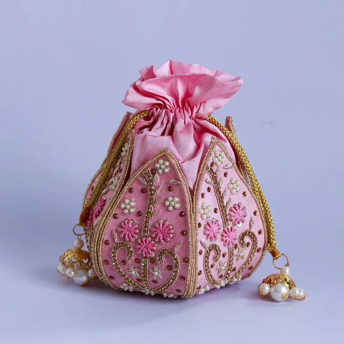 Hand-embroidered mini lotus potli bag by The Tan Clan with intricate floral embroidery and traditional drawstring closure.