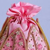 Hand-embroidered mini lotus potli bag by The Tan Clan with intricate embroidery, perfect for traditional or festive occasions.