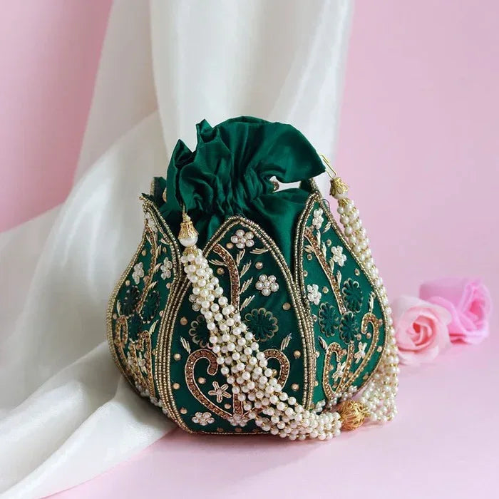 Hand-embroidered mini lotus potli bag with intricate detailing, crafted by The Tan Clan, perfect for traditional and festive occasions.