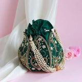 Hand-embroidered mini lotus potli bag with intricate detailing, crafted by The Tan Clan, perfect for traditional and festive occasions.