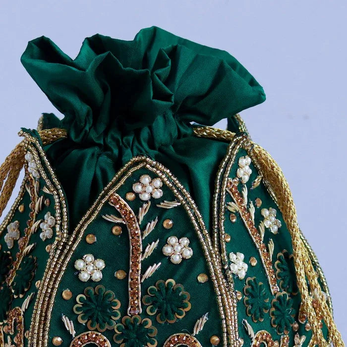 Hand-embroidered mini lotus potli bag by The Tan Clan featuring intricate embroidery and a traditional design.