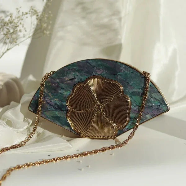 Bahaar brass wirework clutch with mother of pearl accents, designed by The Tan Clan, showcasing intricate craftsmanship and elegant style.
