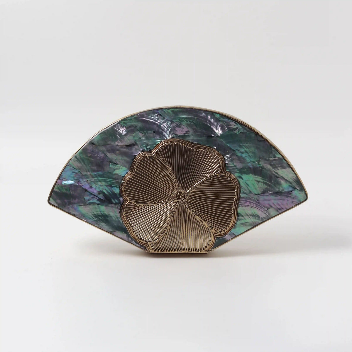 Bahaar brass wirework clutch with mother of pearl accents, crafted by The Tan Clan, featuring intricate design and elegant craftsmanship.