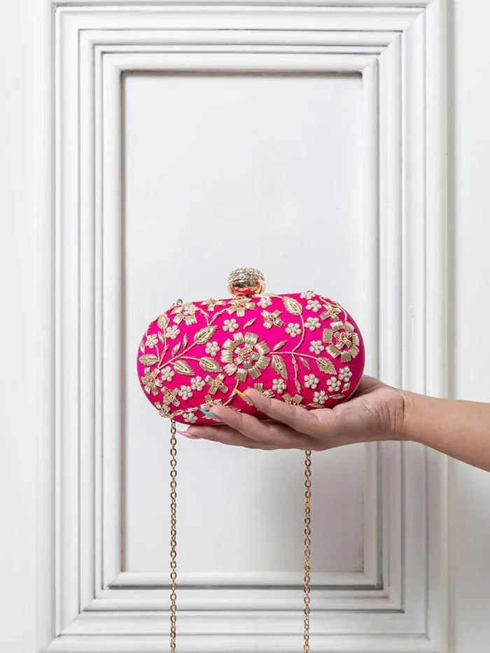 Hand-embroidered Baiza Zardozi clutch bag by The Tan Clan featuring intricate gold embroidery and traditional design.