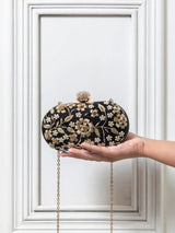 Hand-embroidered Baiza Zardozi clutch by The Tan Clan with intricate Zardozi embroidery and traditional craftsmanship.