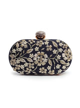 Elegant Baiza Zardozi hand-embroidered clutch by The Tan Clan with intricate gold embroidery and a classic design.