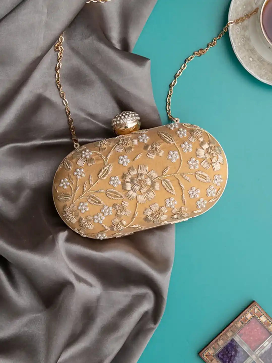 Hand-embroidered Baiza Zardozi clutch bag by The Tan Clan featuring intricate Zardozi embroidery and traditional craftsmanship.