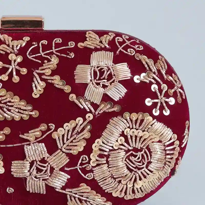 Hand-embroidered Begum Zardozi clutch by The Tan Clan with intricate gold embroidery and traditional design, perfect for special occasions.