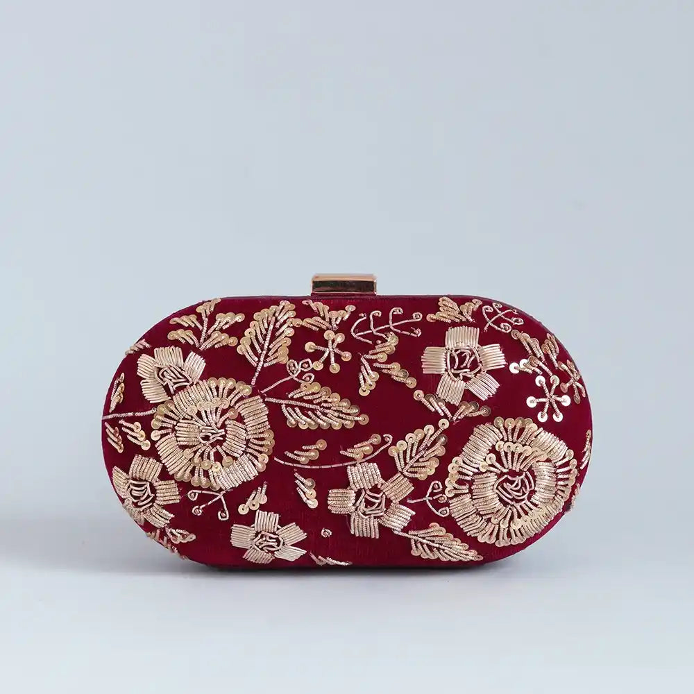 Begum Zardozi hand-embroidered clutch by The Tan Clan with intricate gold embroidery and traditional design.