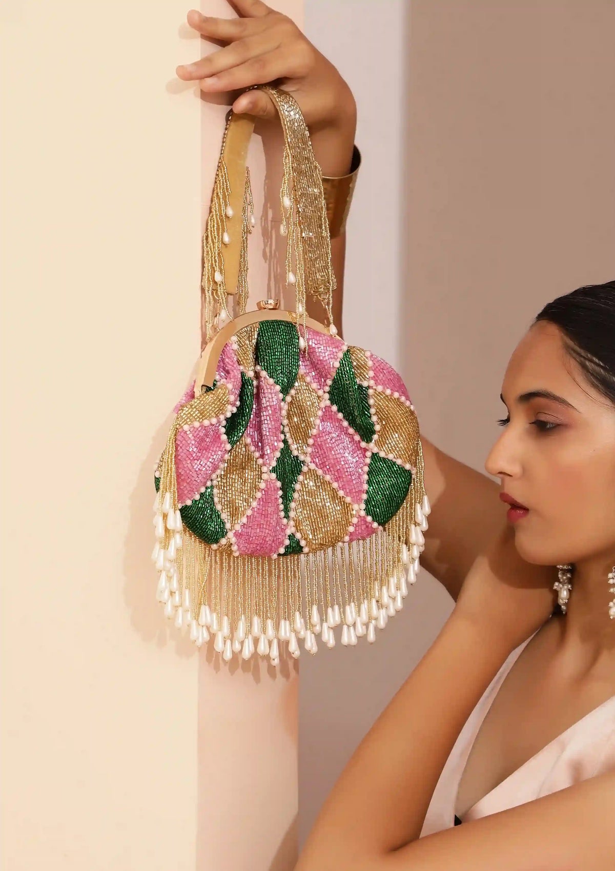 Bliss Batua Bag by The Tan Clan featuring a detachable handle and traditional woven design in natural colors.